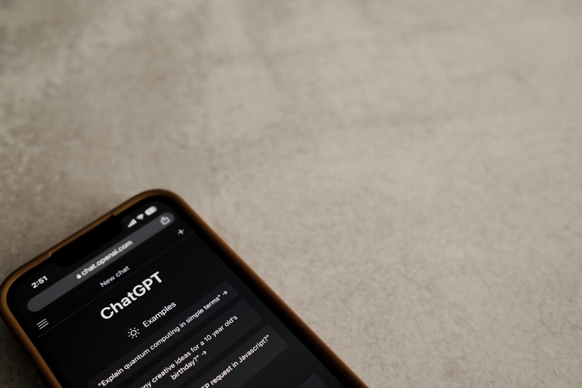 A person smiling while looking at a laptop screen showing earnings and AI-generated content.